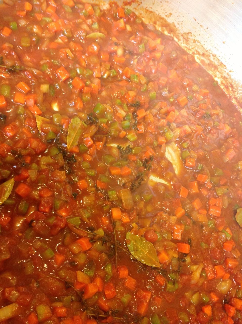 Add beef stock and chopped tomatoes, bring to a boil