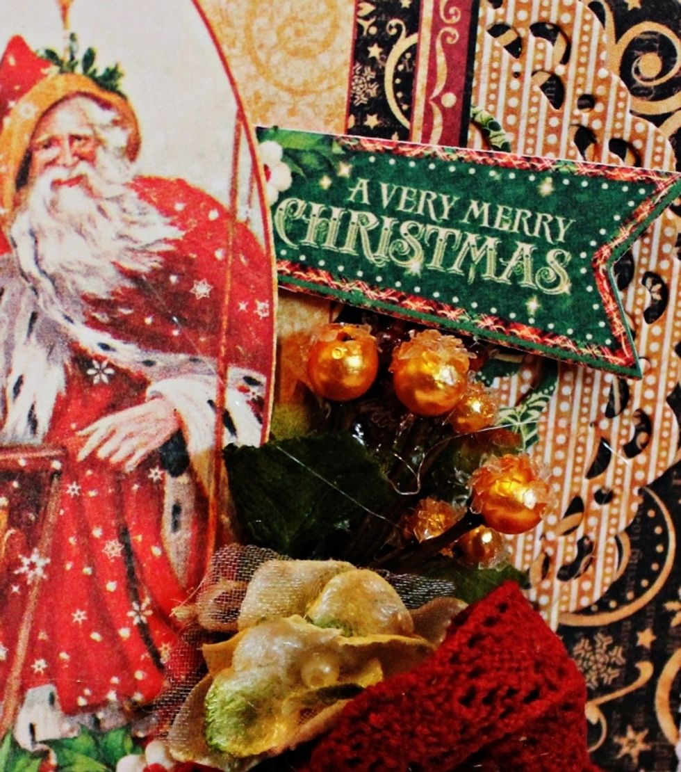Add berry cluster to card front with Xyron Adhesive Dots. Place St Nicholas "A Very Merry Christmas" to top of card.