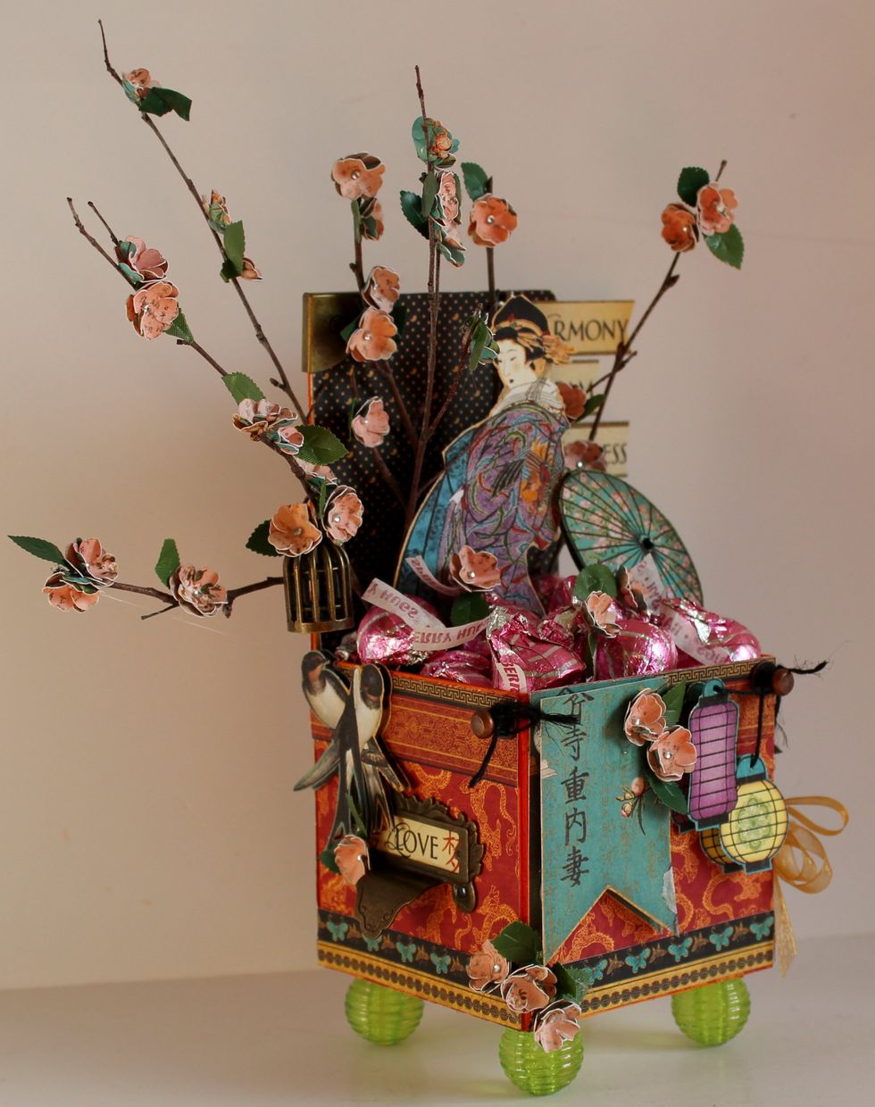 Add Birdsong to box once it is formed, add metals, fussy cut outs from paper, place on beads