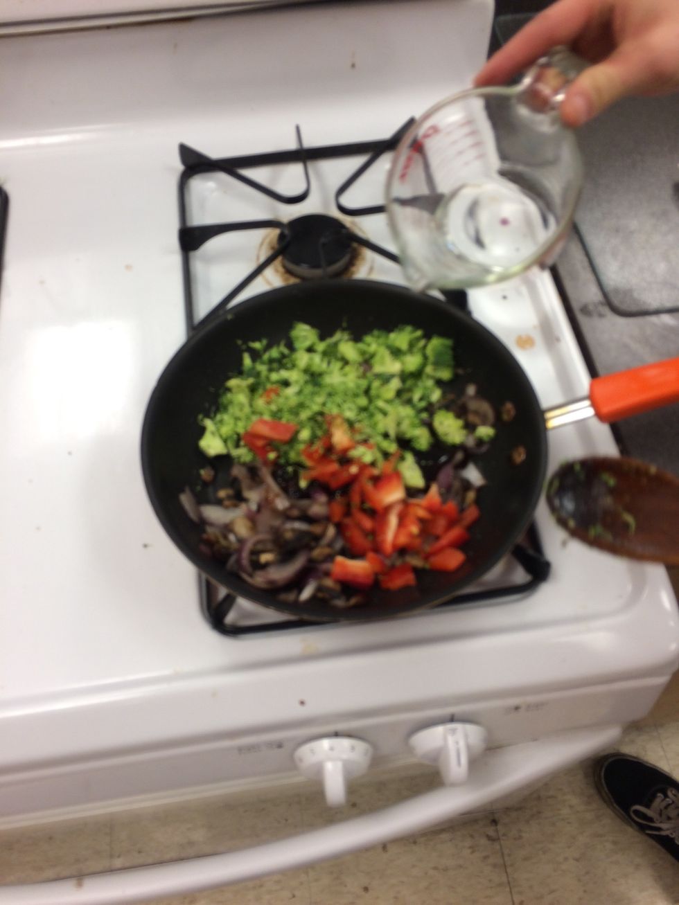 Add black bean sauce, broccoli, and red bell pepper to pan