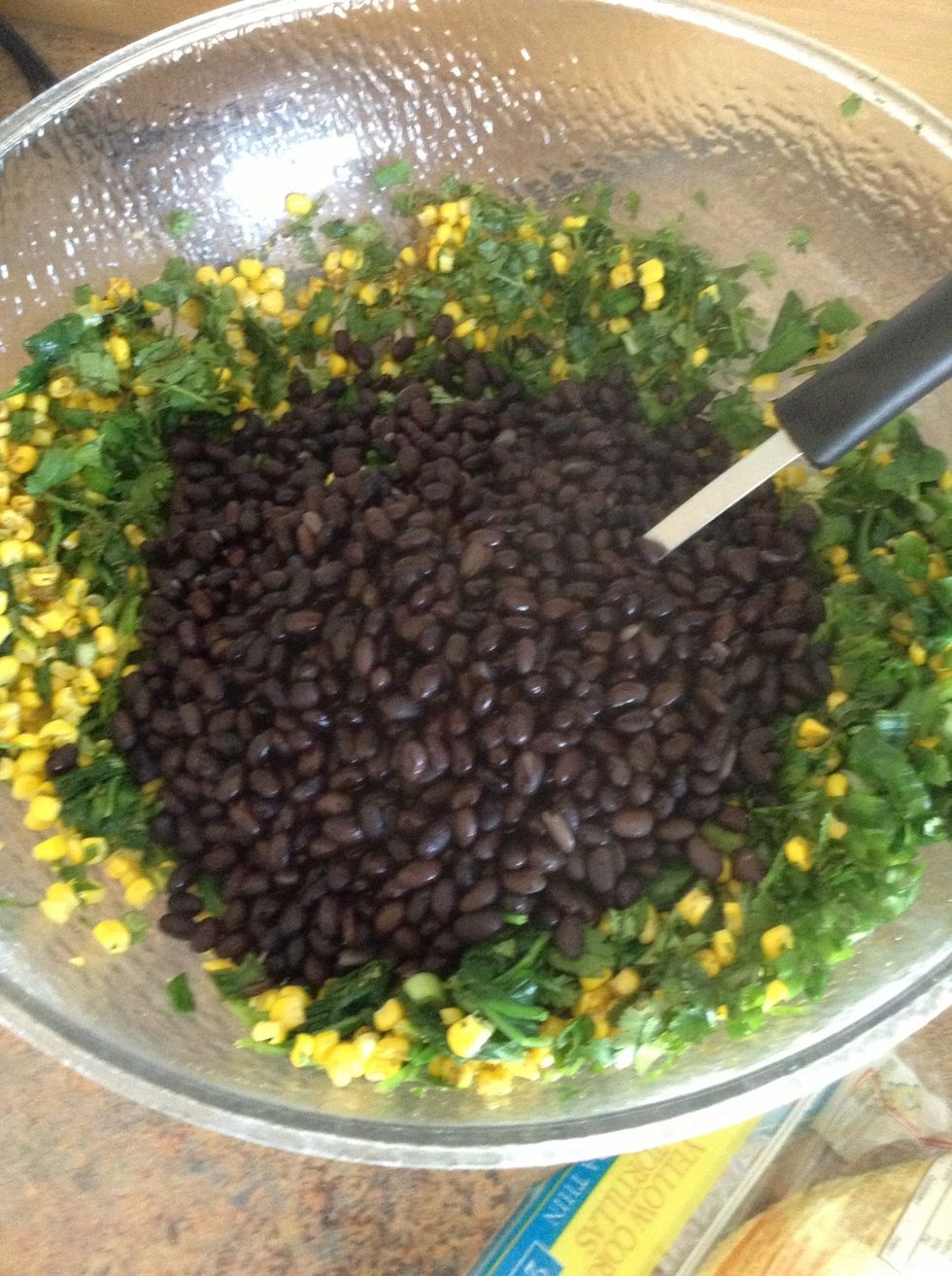 Add black beans to the bowl