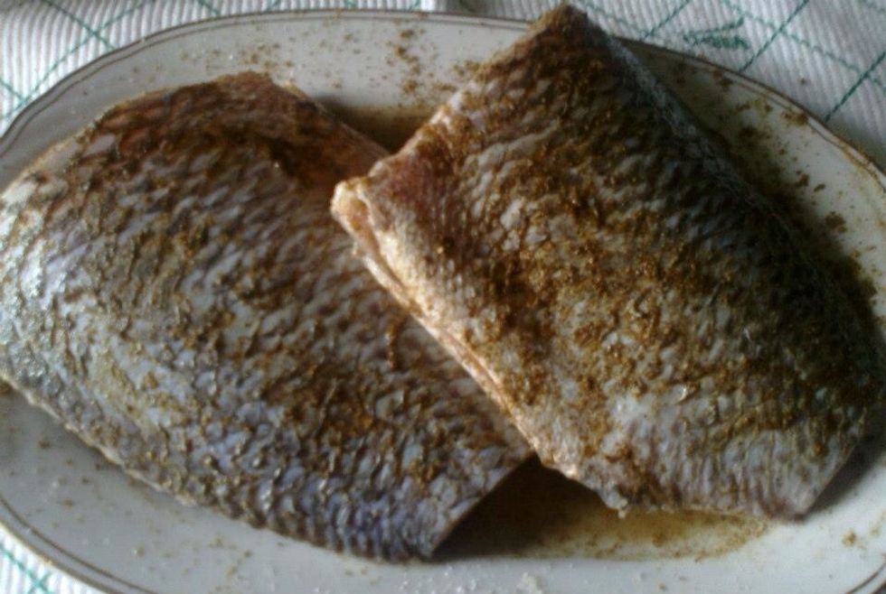 Add black pepper, cumin and spices on the fish and leave it in the refrigerator for two hours