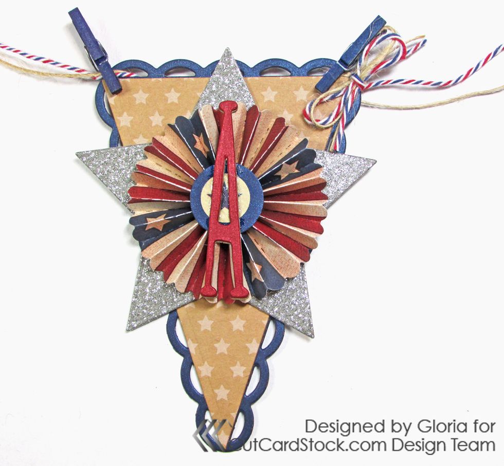 Add blue clothespins to the "A" pennant. Tie a tiny bow with twine and glue it to the right corner of the pennant.