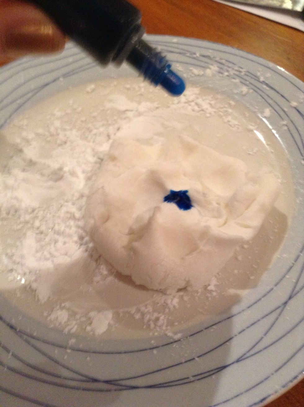 Add blue food dye to a handful of moulding icing