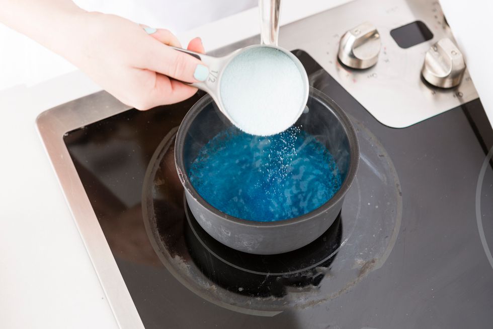 Add blue JELL-O to boiling water and stir two minutes or until completely dissolved.
