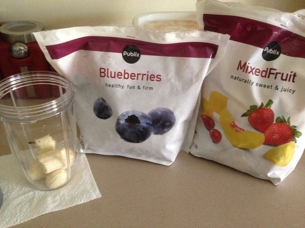 Add blueberries and mixed fruit. I use frozen fruit because it makes the smoothie cold. And the fruit never goes bad in the freezer :)