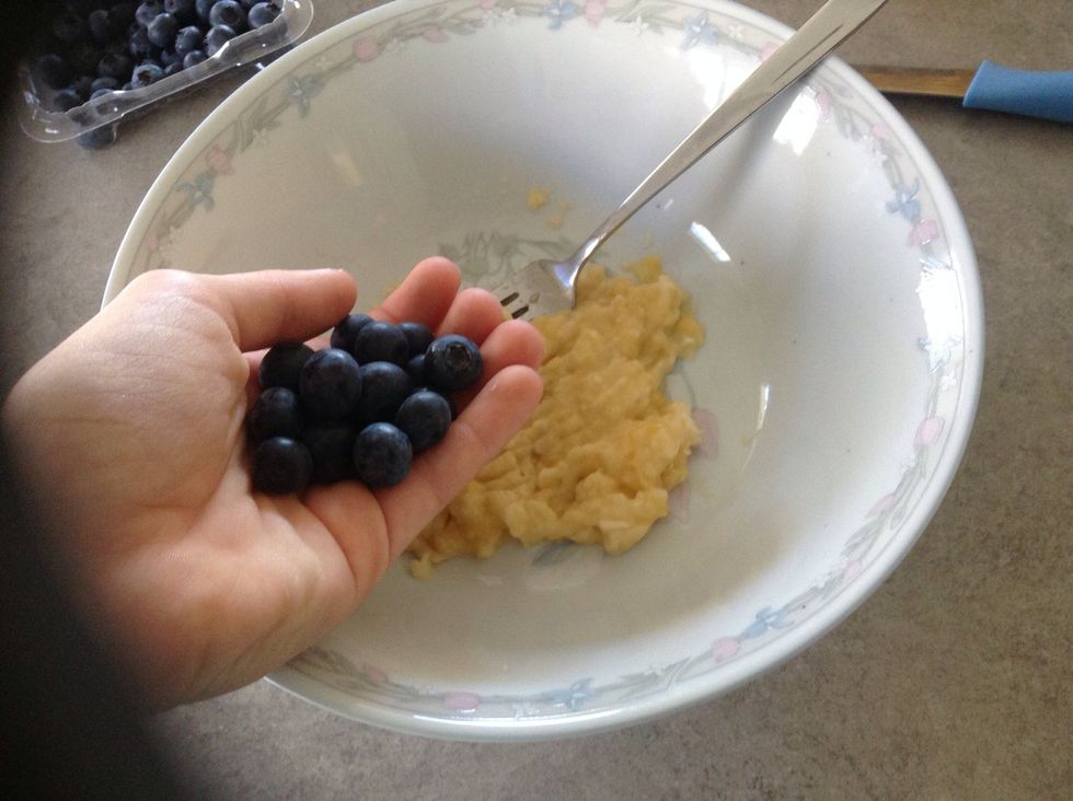 Add blueberries and slightly crush