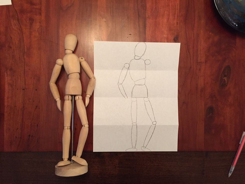 Add Bob's lower arm. Bob's lower arm is titled in and ends at Bob's hip joints.