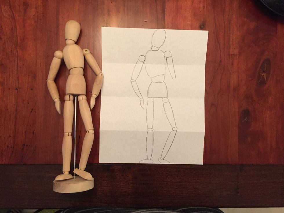 Add Bob's right upper arm. Bob's arm should end at the top of Bob's hips.