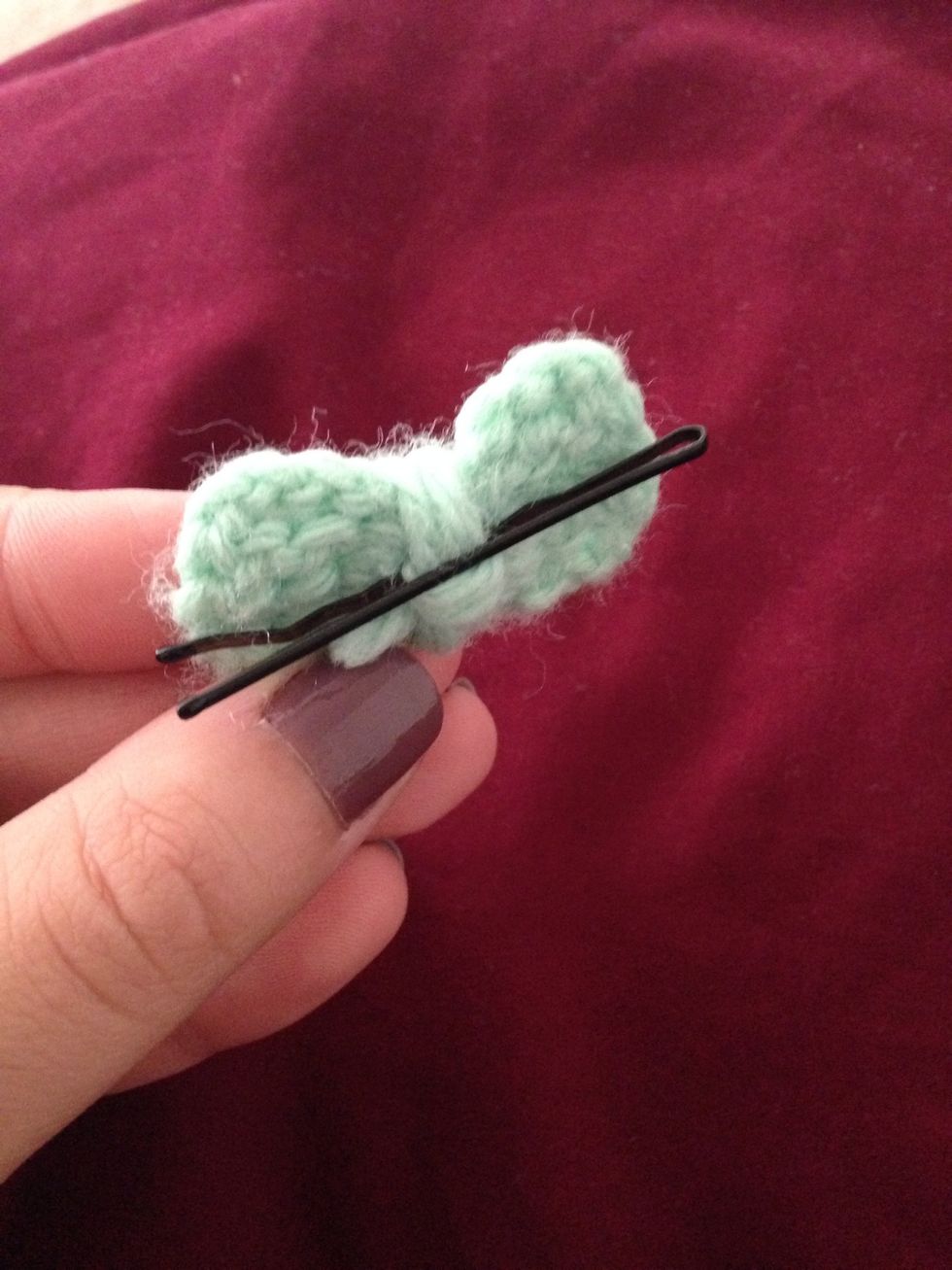 Add bobby pin in back of the bow.