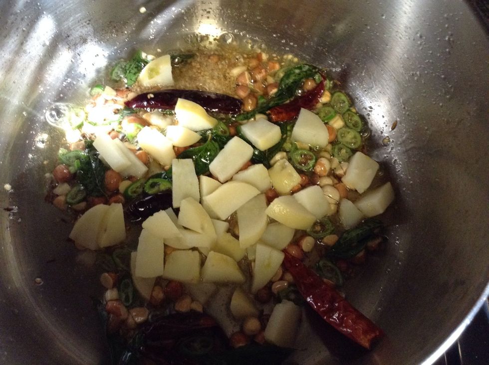 Add boiled potatoes, let it turn little crispy and golden brown