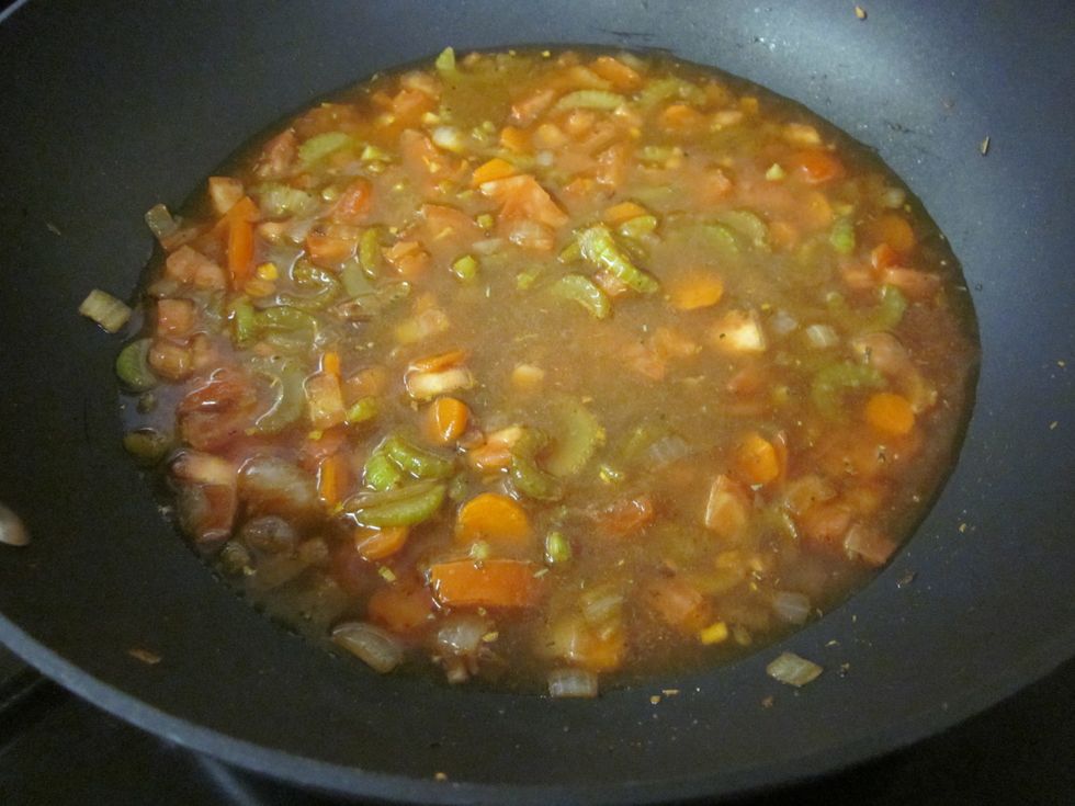 Add both of those to the sauteed vegetables and the seasonings.