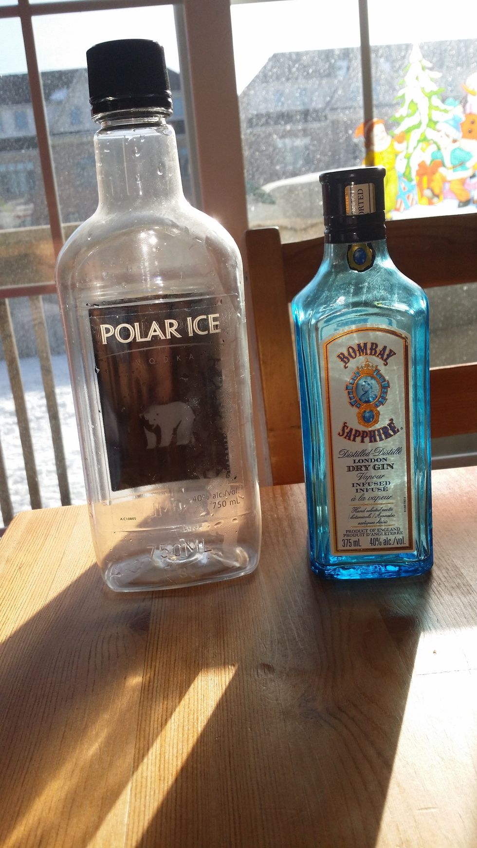 Add Bottle of Gin and Vodka to a Container that can sealed for a few days, Also be sure to mix both alcohols together before adding tea so they are well mixed.