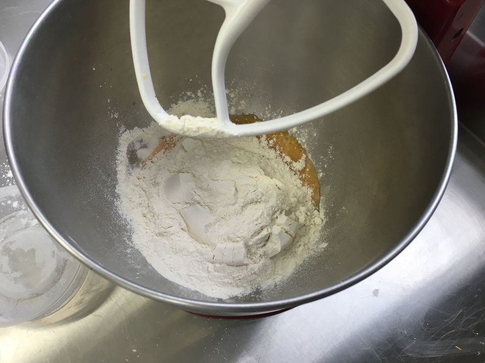 Add bread flour, sea salt, eggs, and sugar to poolish.