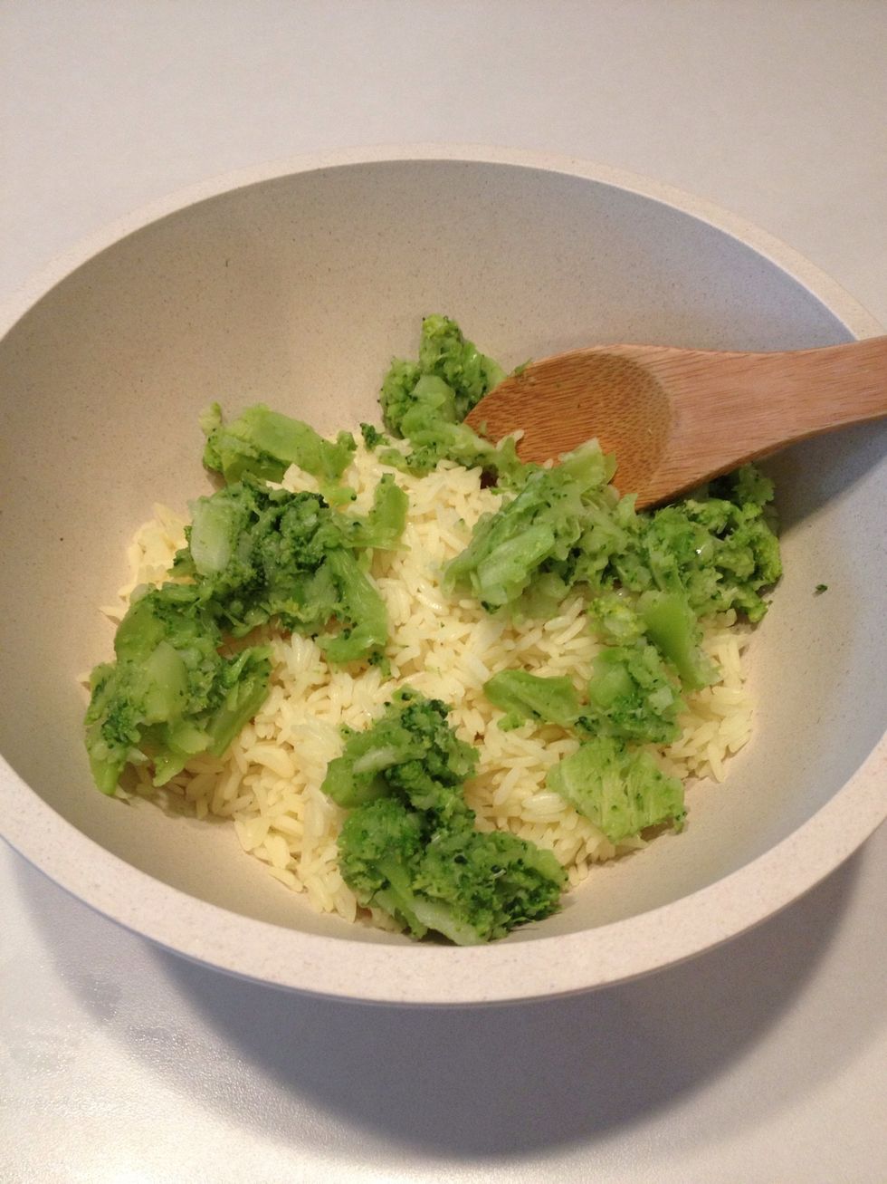 Add broccoli to bowl of rice.