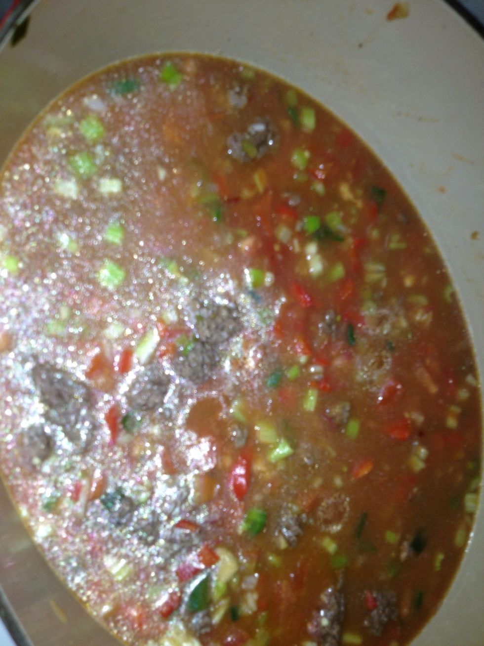 Add broth 2 cups rice 1 1/2 cups water one can tomato sauce stir before next step