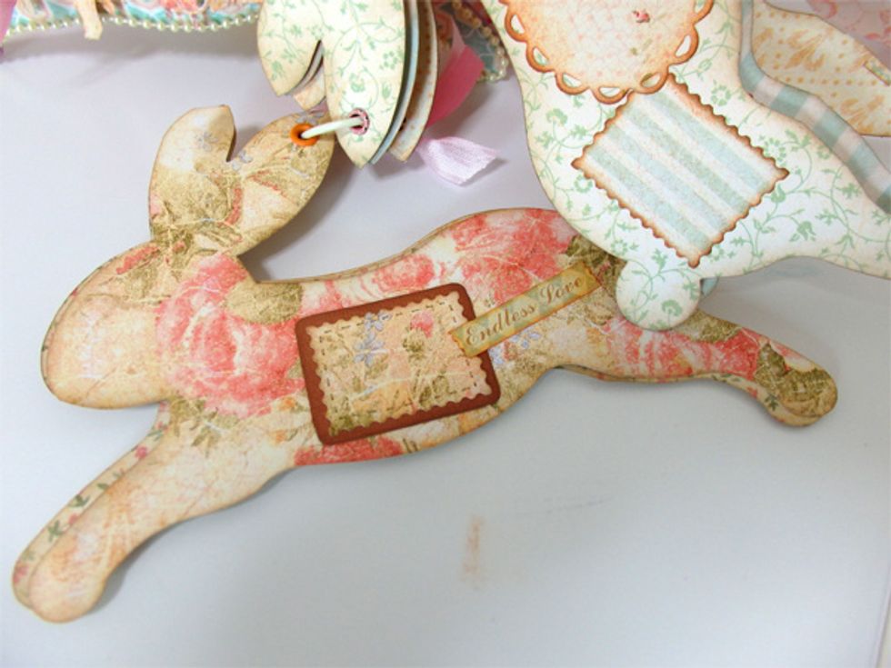 Add Brown paper with stamp cutting paper and write the stitches then Add Baby 2 Bride Cardstock Stickers