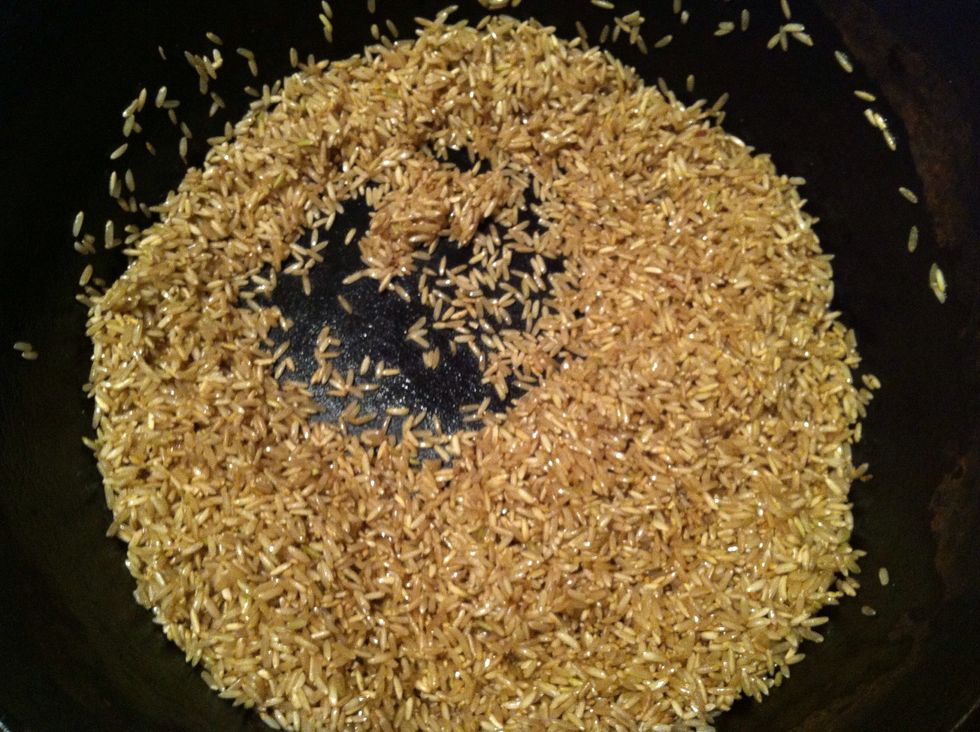 Add brown rice and stir constantly for 3-4 minutes or until browned.