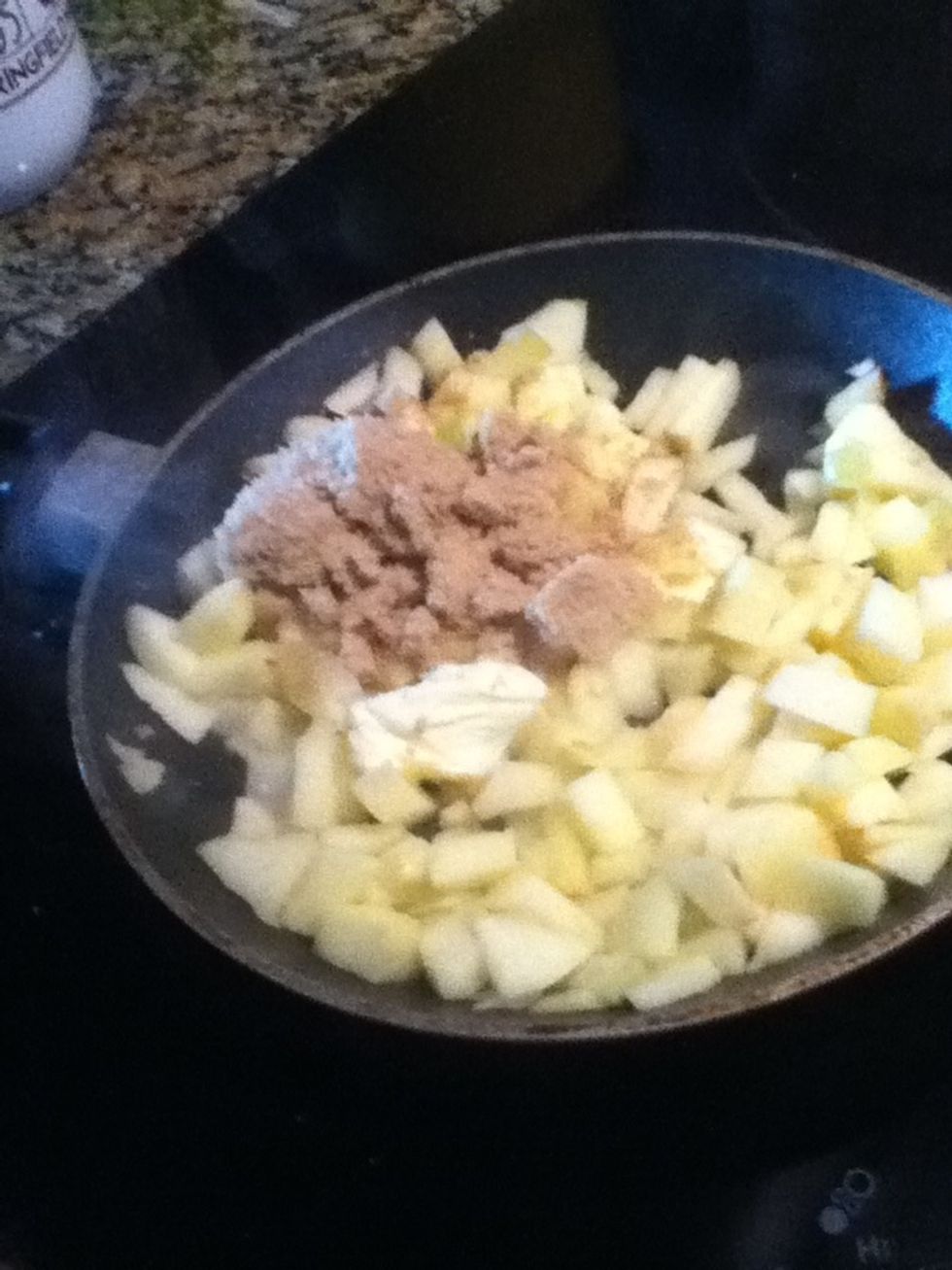 Add brown sugar and butter to the apples, however much you'd like, about half way into cooking the apples.