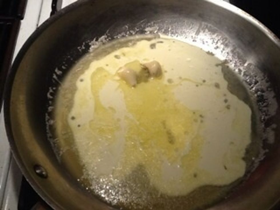 Add butter and 2 garlic cloves to med-low pan. Saut\u00e9 for 2-3 minutes. Add cream and 1/2 c parmigiano. Salt to taste