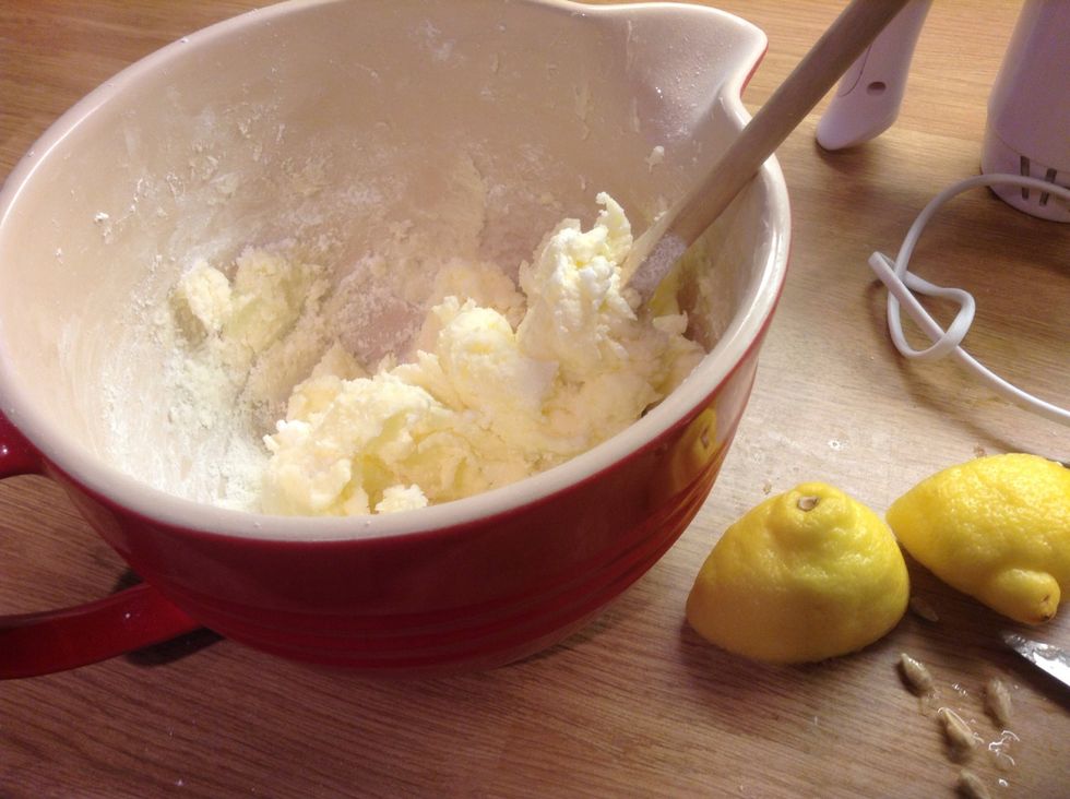 Add butter and icing sugar into a bowl and keep mixing. Add the juice of one and a half lemons. Mix with a whisk on high for 5 minutes. Then add a half a tub of Philadelphia :-)