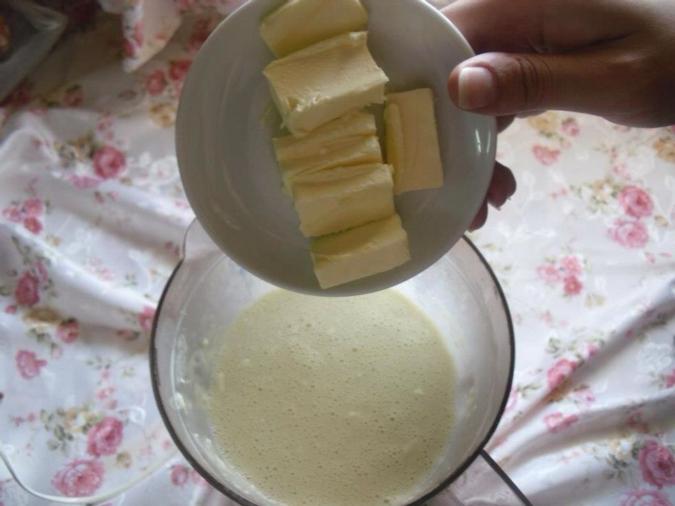 Add butter and turn on the blender