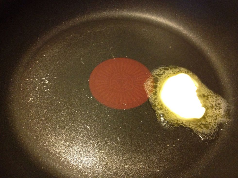 Add butter or margarine to heated pan