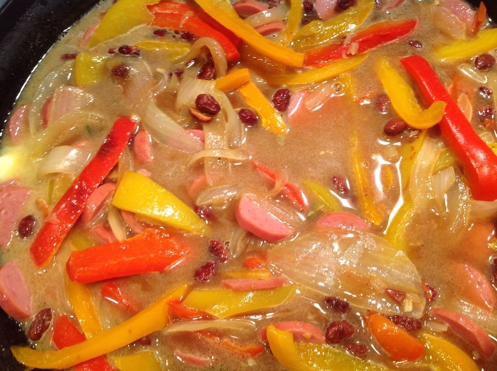 Add butter & pour water in skillet.  Bring to a boil, stirring occasionally.  Turn heat down to medium low and cover.  Cook 25-30 minutes stirring occasionally until most of the water is absorbed.