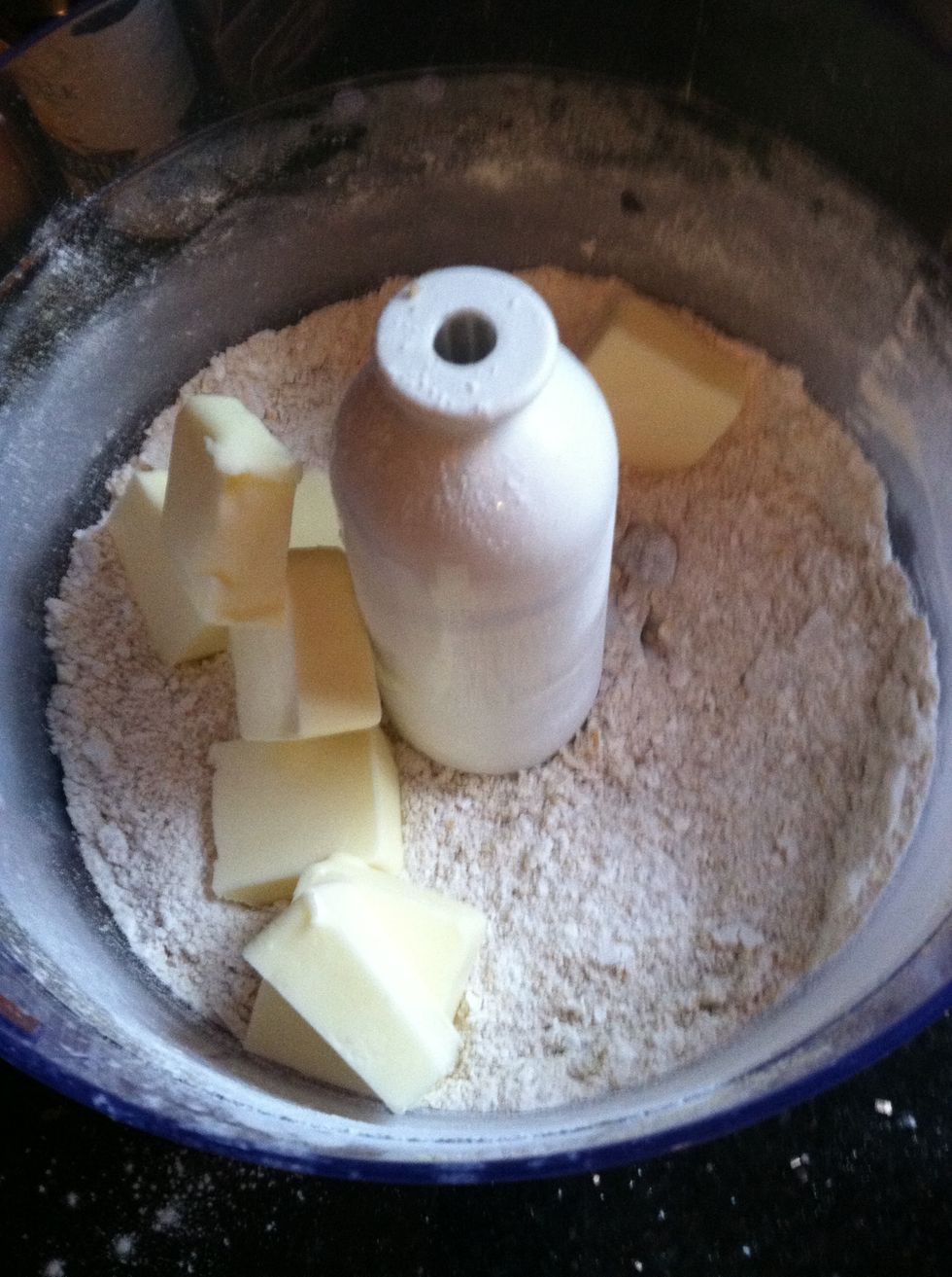 Add butter slices and pulse till crumbly and set aside.