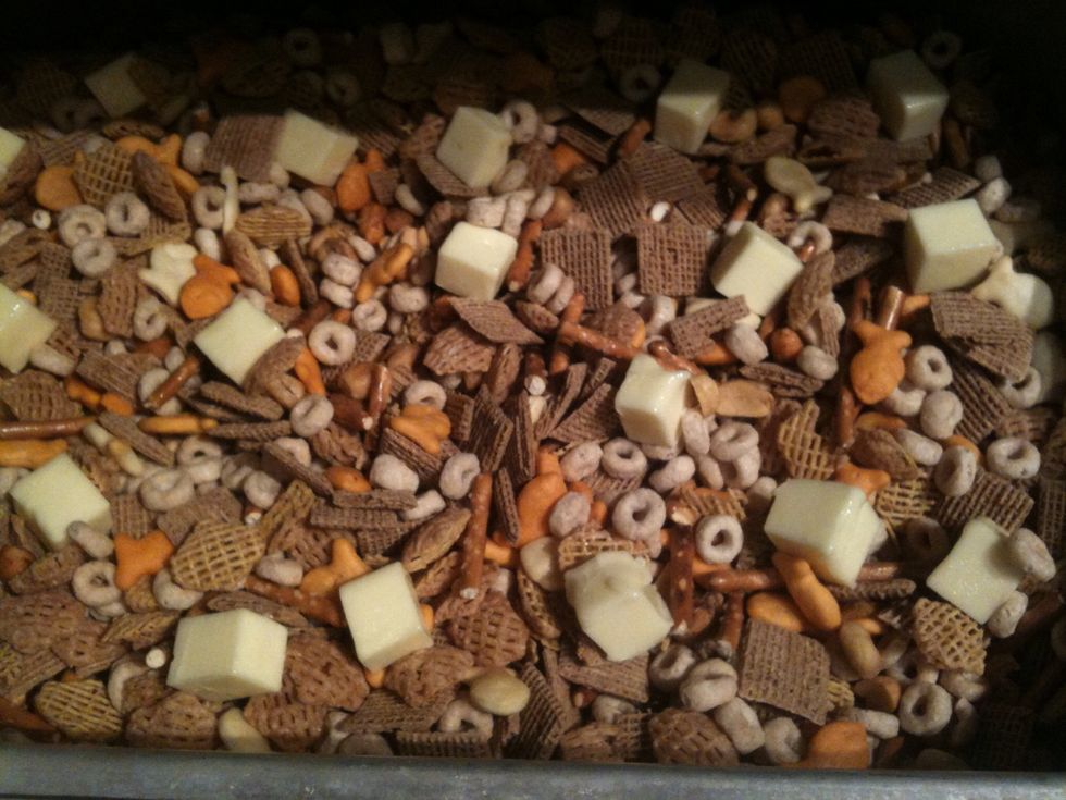 Add butter slowly so it can coat most of the mixtures. Stir each time before adding more butter. Careful you don't crush up the mixture . I do 15-20 mins in oven between adding butter.