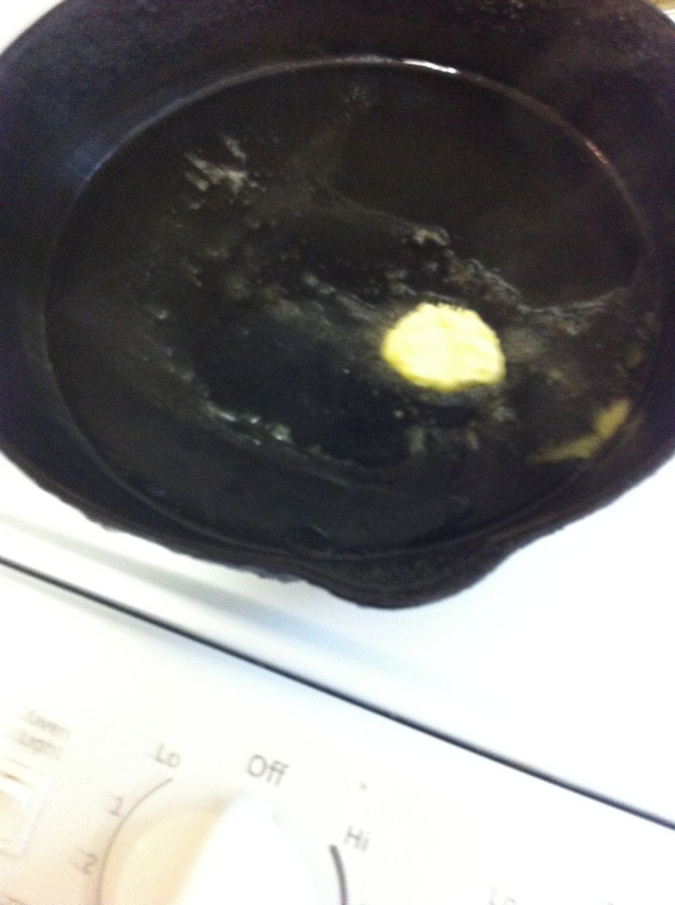 Add butter to a warm skillet. Im using a cast iron skillet but you can use any type of skillet. Cast Iron holds heat better and cooks the seasoning within.