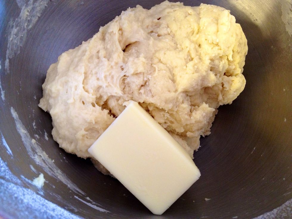 Add butter to the dough. Mix well on low speed until combined.