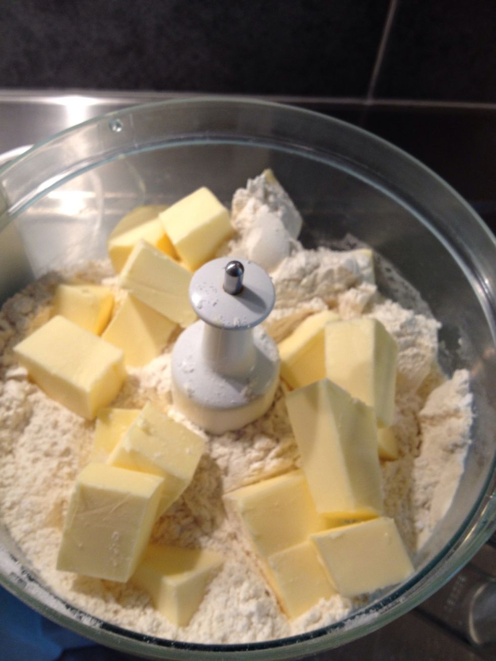 Add butter to the dry ingredients and mix mix mix! It should look like crumble when it's ready for the next step.