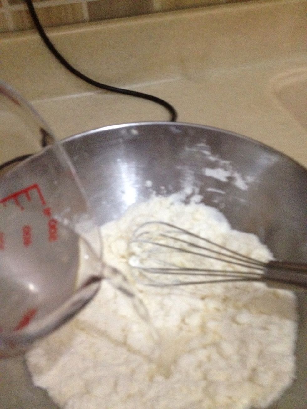 Add butter to the flour and mix but don't knead Then pour water slowly (don't put all water at one time)