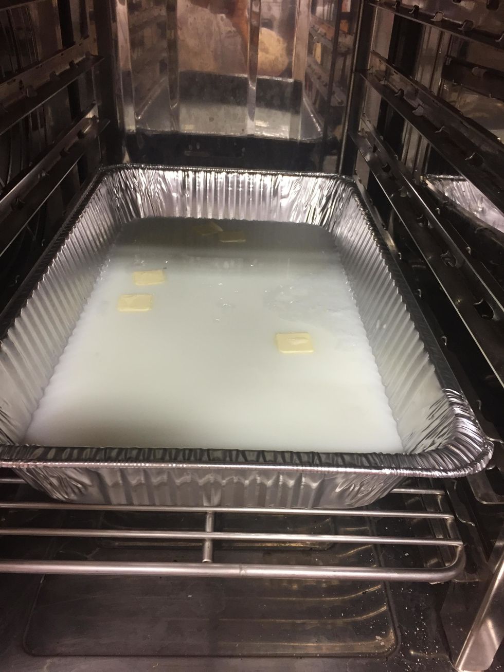 Add butter to the milk as the combi preheats.