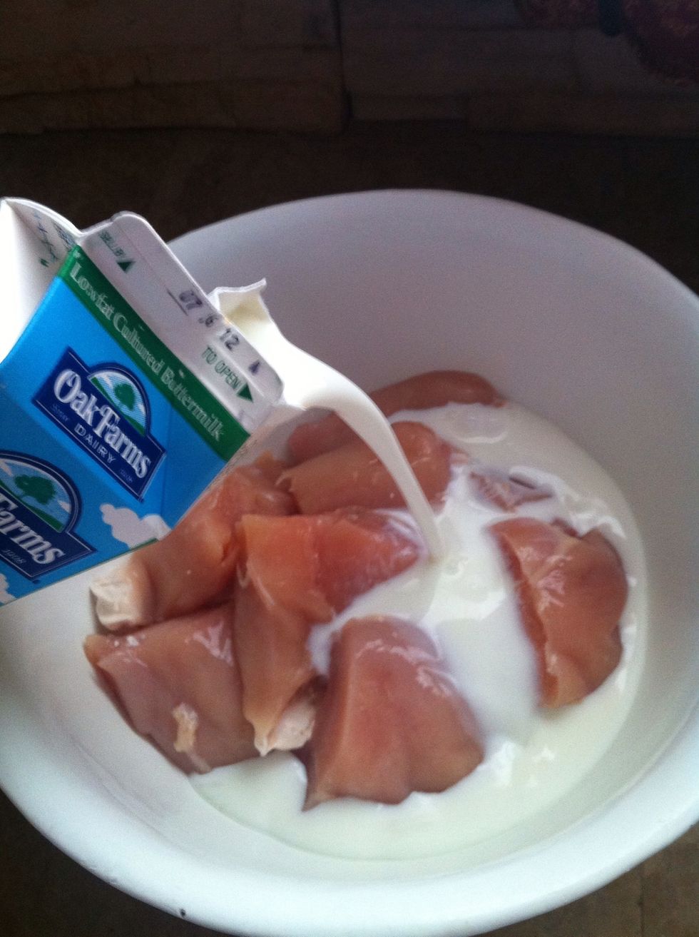 Add buttermilk, until it covers all the chicken.