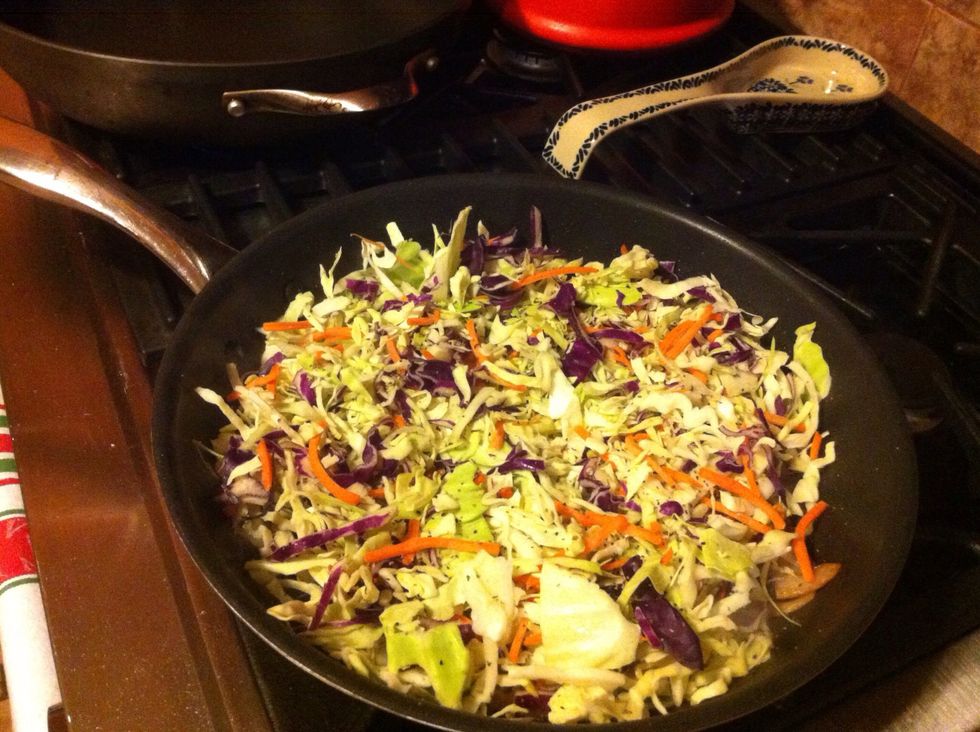 Add cabbage, carrots, salt and pepper.