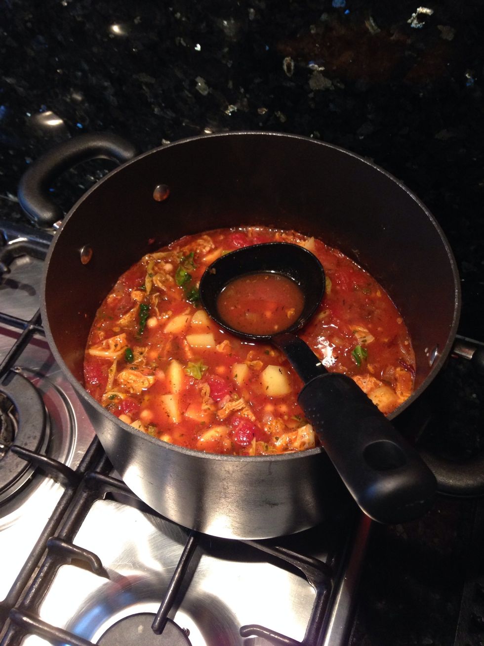 Add cabbage, chickpeas, chapped potatoes, salt, pepper, mixed herbs and lemon juice. Leave simmering on a low heat with lid on the pot until potatoes cooked