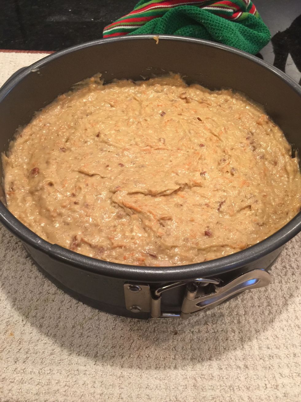 Add cake batter to parchment paper lined springform pan.