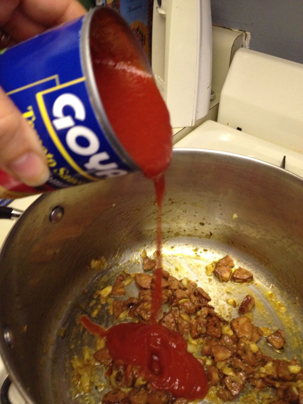Add can of Goya tomato sauce.