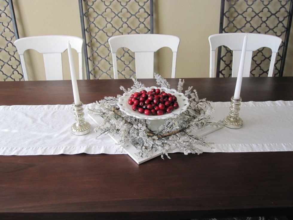 Add candlesticks with candles to either side of the centerpiece and enjoy. More at livelyandlovely.com