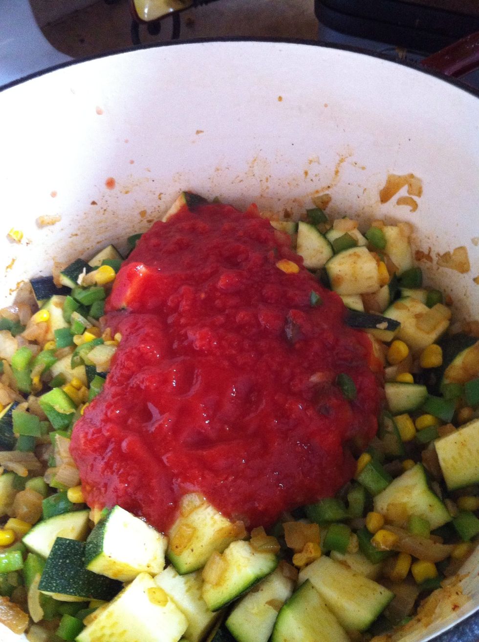 Add canned tomato sauce and stewed tomatoes..