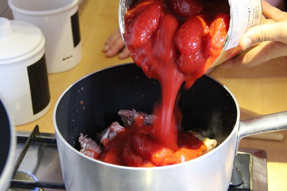 Add canned tomatoes and cook for 1 and 1/2 to 2 hours on low flame...enjoy