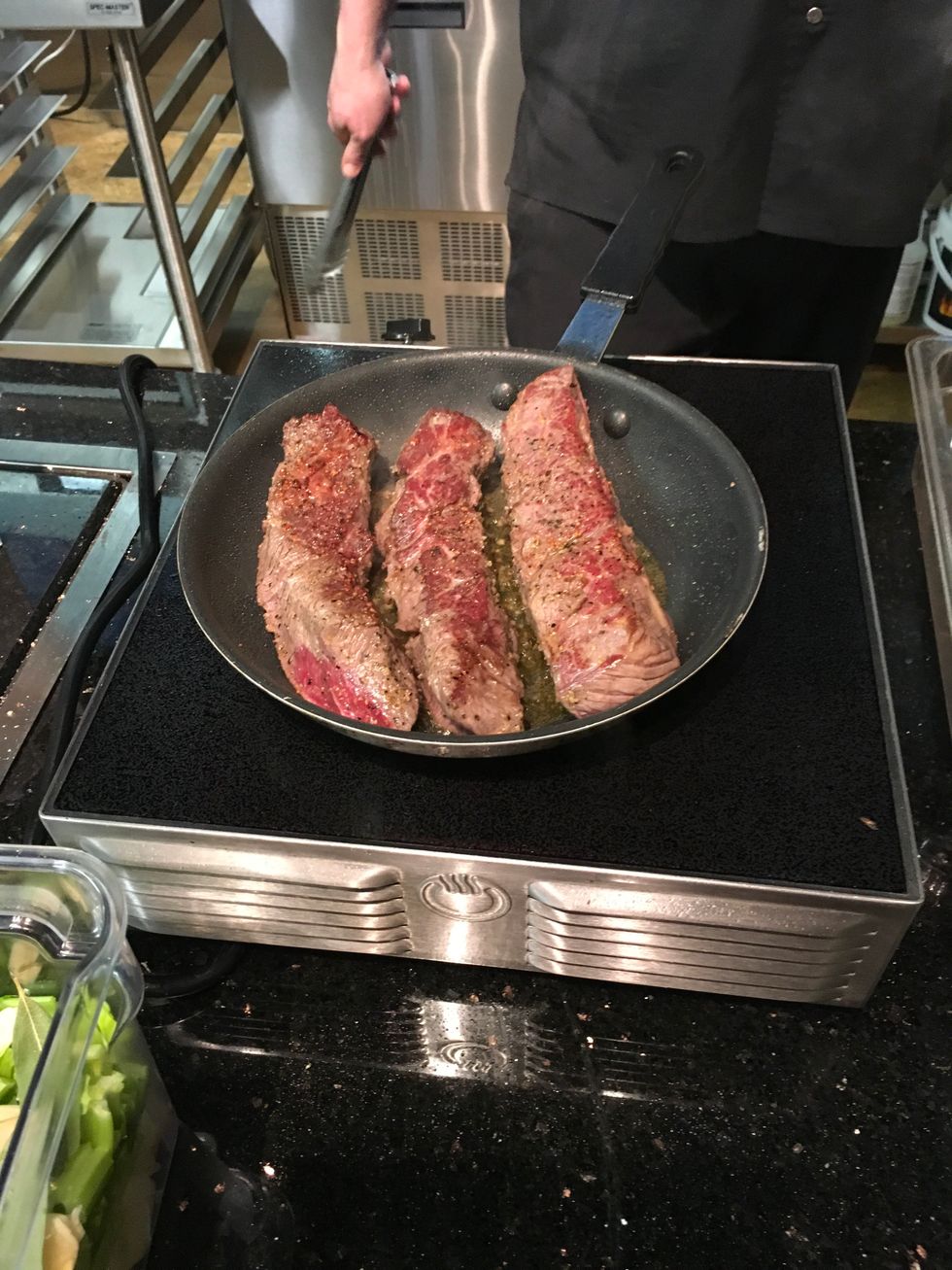 Add Canola oil to the pan and heat. Add beef ribs to pan and sear.