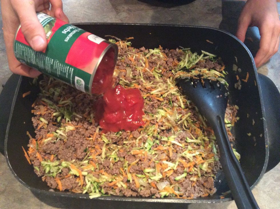 Add cans of Roma tomatoes.