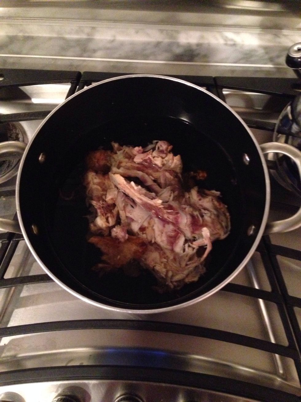 Add carcass and 7 cups of water to a medium pot. Cook over medium heat