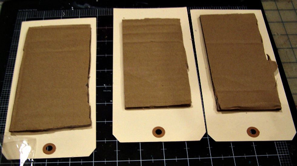 Add cardboard to front of tags