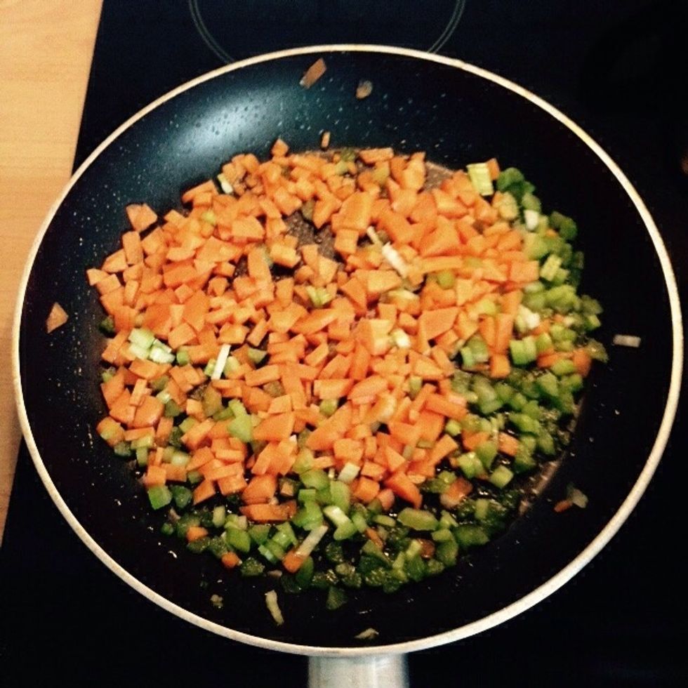 Add carrot and celery to a pan with olive oil and a splash of water
