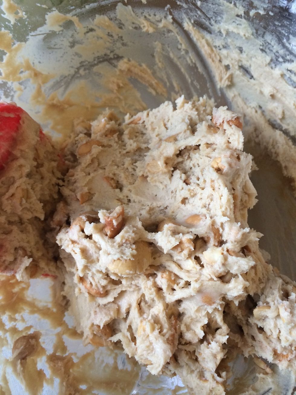Add cashews and stir in cashews by hand