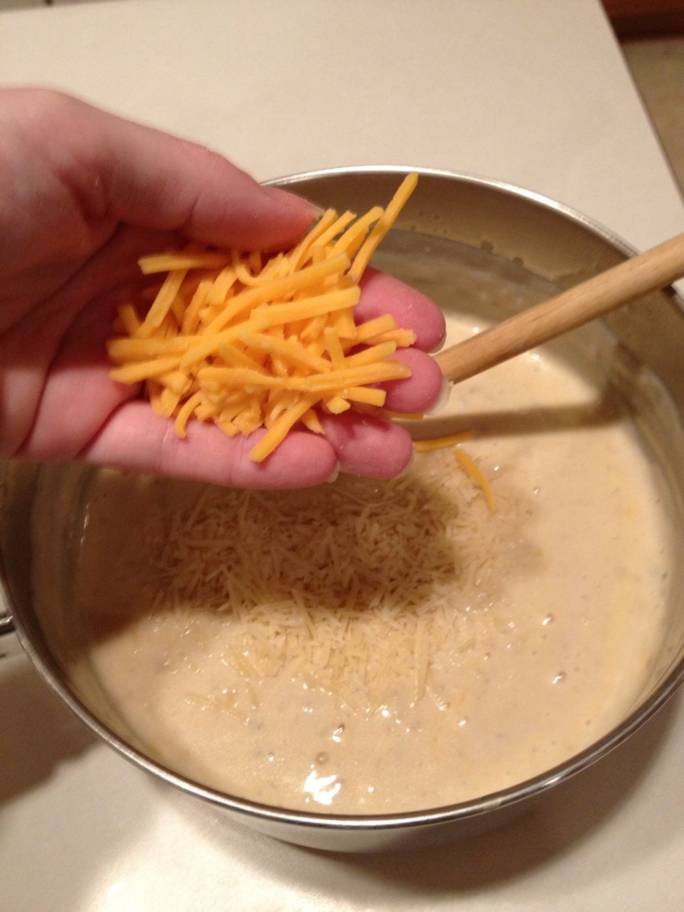 Add cheddar cheese. Stir well to melt.